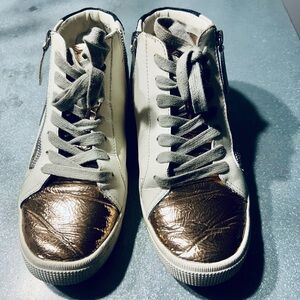 Dolce Vita White and Gold High-Top Sneakers
They actually look better in person